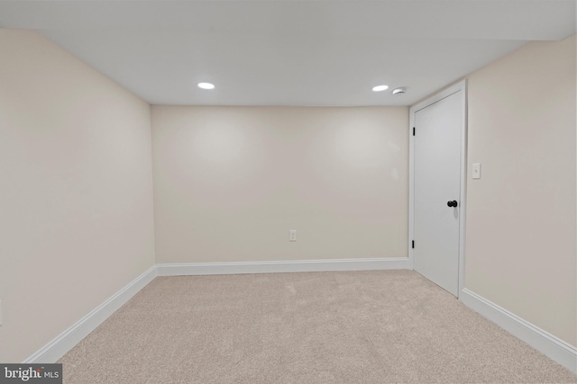 empty room with light colored carpet