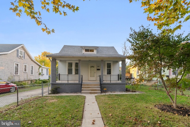 bungalow with a porch and a front yard