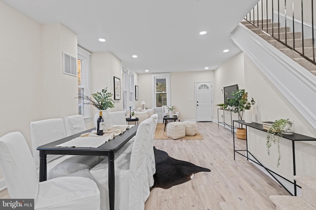 dining space with light wood-type flooring