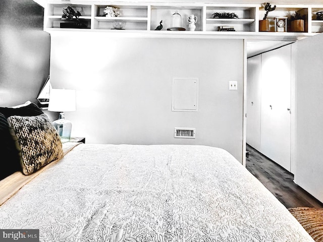 bedroom featuring dark wood-type flooring