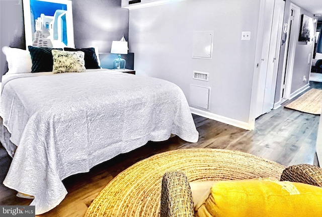 bedroom with wood-type flooring