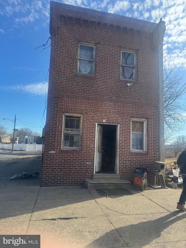 view of front of house featuring brick siding