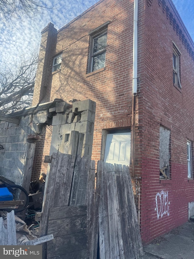 view of home's exterior with brick siding