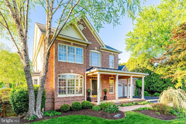 view of front of property featuring a porch and brick siding