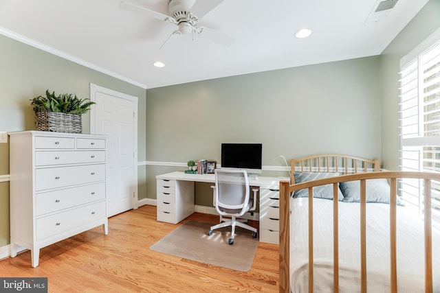 office area featuring plenty of natural light, a ceiling fan, light wood finished floors, and crown molding