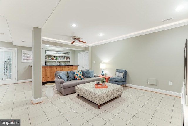 living area featuring bar, ceiling fan, light tile patterned floors, baseboards, and recessed lighting