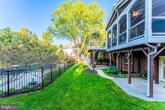 view of yard with a fenced backyard, a patio, and a wooden deck