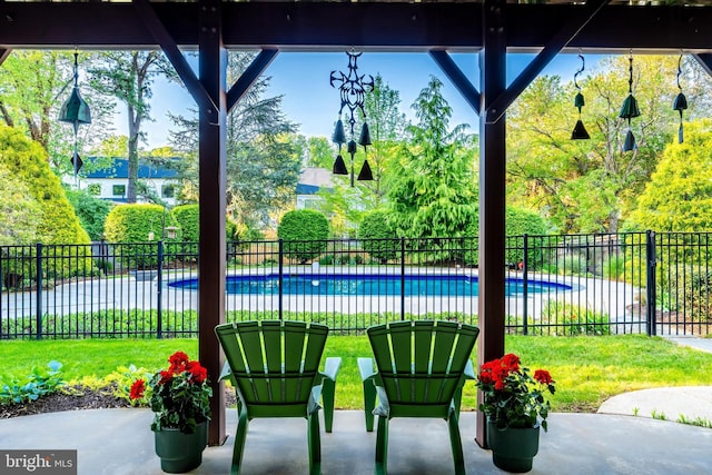 view of patio with fence and a fenced in pool