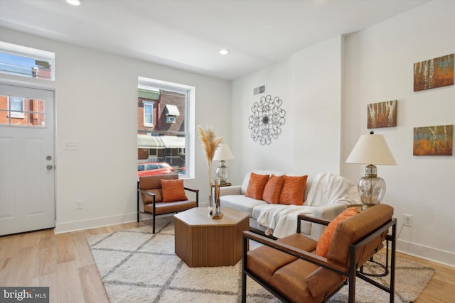 living room with light hardwood / wood-style floors