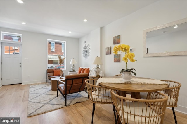 dining area with light hardwood / wood-style flooring