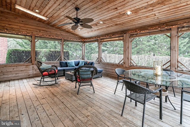 sunroom / solarium with lofted ceiling, ceiling fan, and wood ceiling