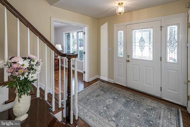 foyer with dark hardwood / wood-style flooring