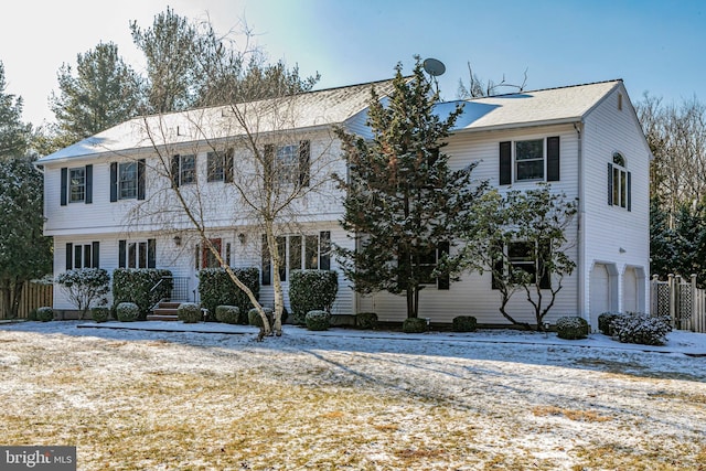 colonial home with a garage