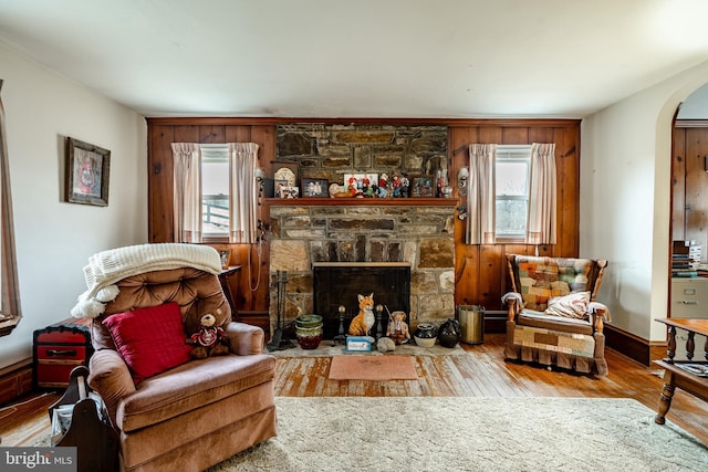 sitting room featuring hardwood / wood-style floors, a wealth of natural light, and a fireplace