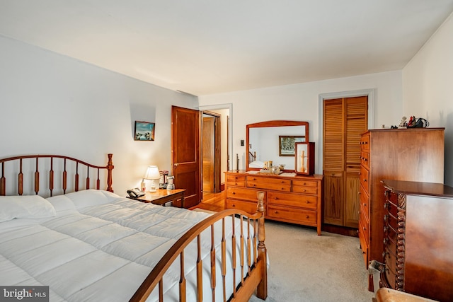 carpeted bedroom featuring a closet