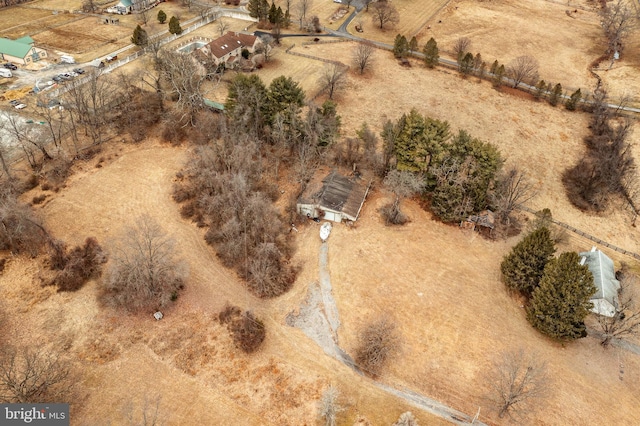 birds eye view of property featuring a rural view