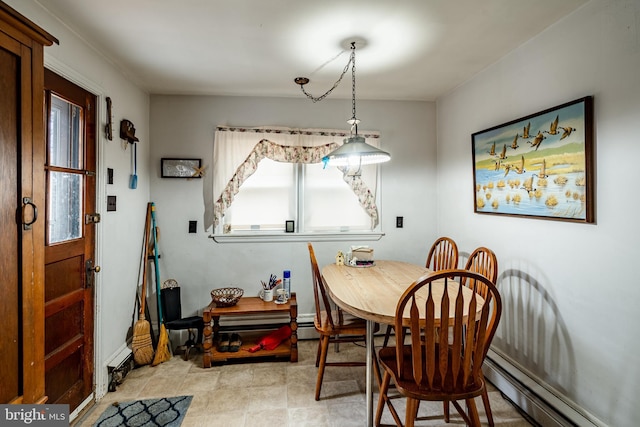 dining space featuring a baseboard heating unit