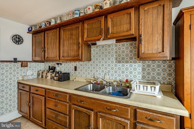 kitchen with tasteful backsplash and sink