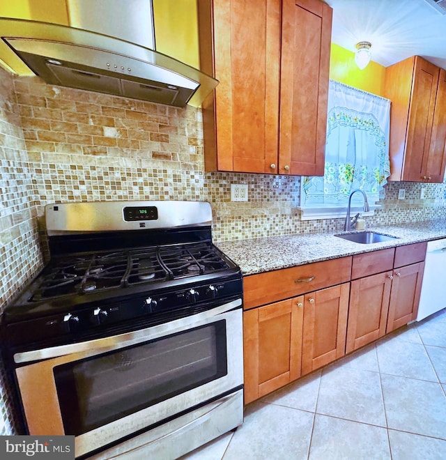 kitchen with gas range, exhaust hood, a sink, dishwasher, and light stone countertops