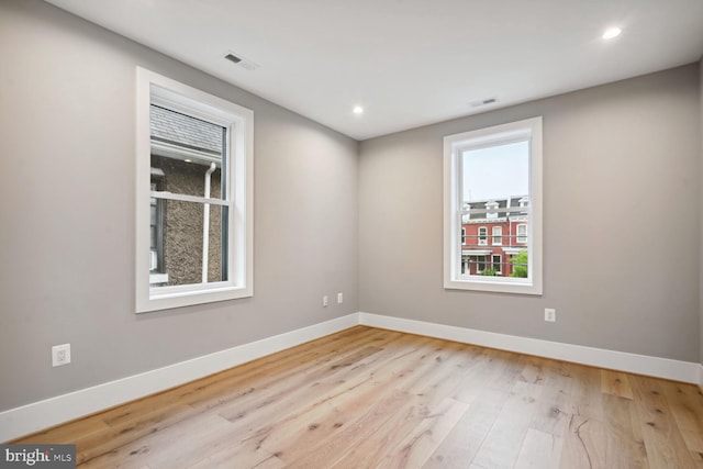 unfurnished room featuring light wood-type flooring