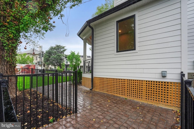 view of side of property featuring a patio area