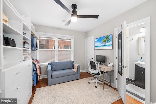 office featuring hardwood / wood-style floors and ceiling fan