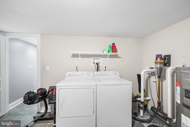 clothes washing area featuring separate washer and dryer