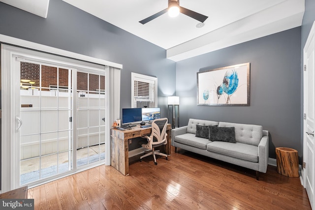 office with hardwood / wood-style flooring and ceiling fan