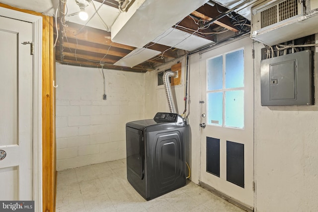 washroom with washer / dryer, laundry area, electric panel, and tile patterned floors