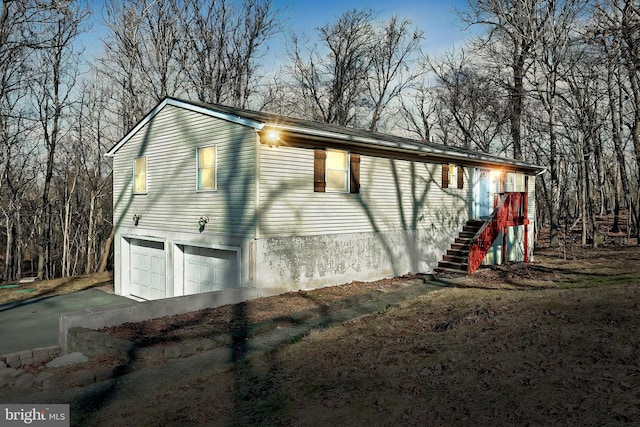 property exterior at dusk with a garage