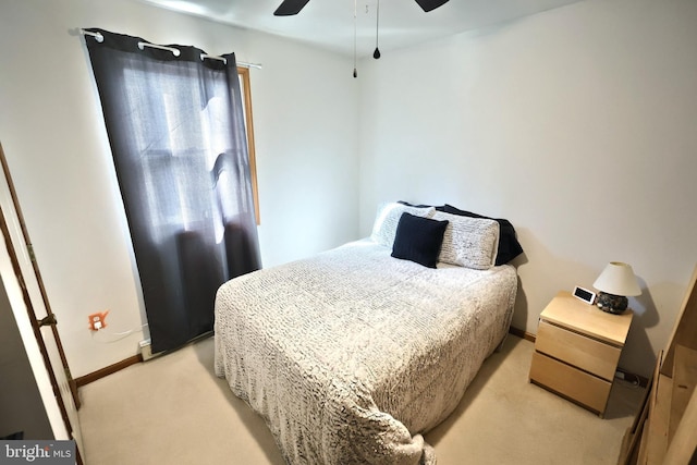 bedroom featuring ceiling fan and light colored carpet