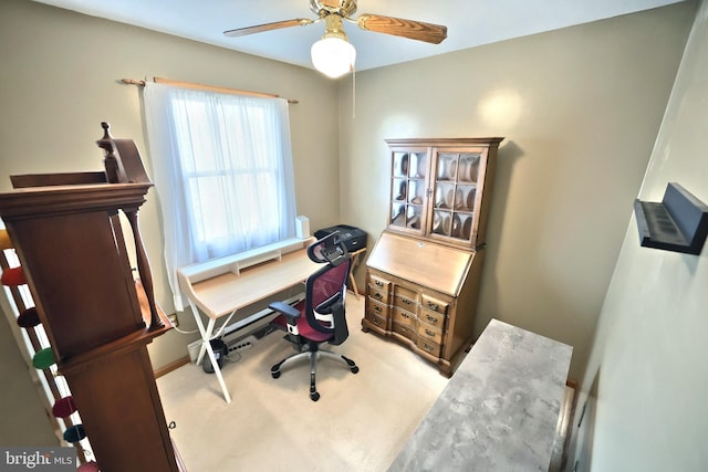 office featuring light carpet and ceiling fan