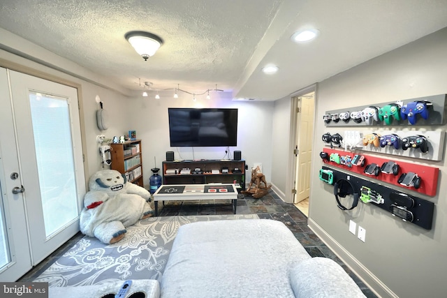 living room with a textured ceiling