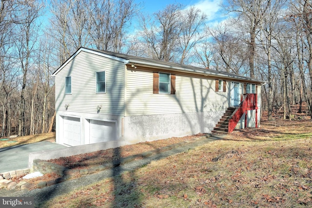 view of side of property featuring a garage