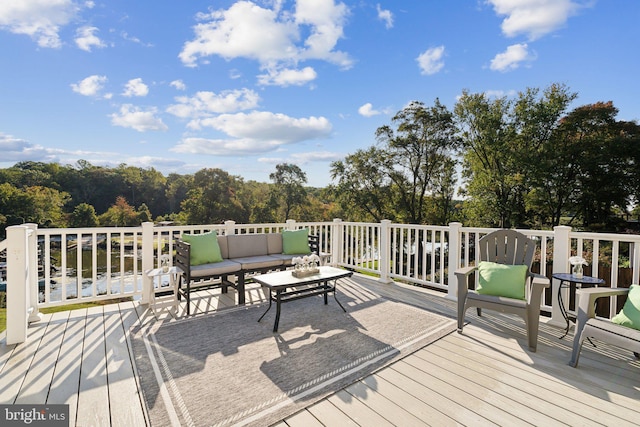 wooden terrace featuring an outdoor hangout area