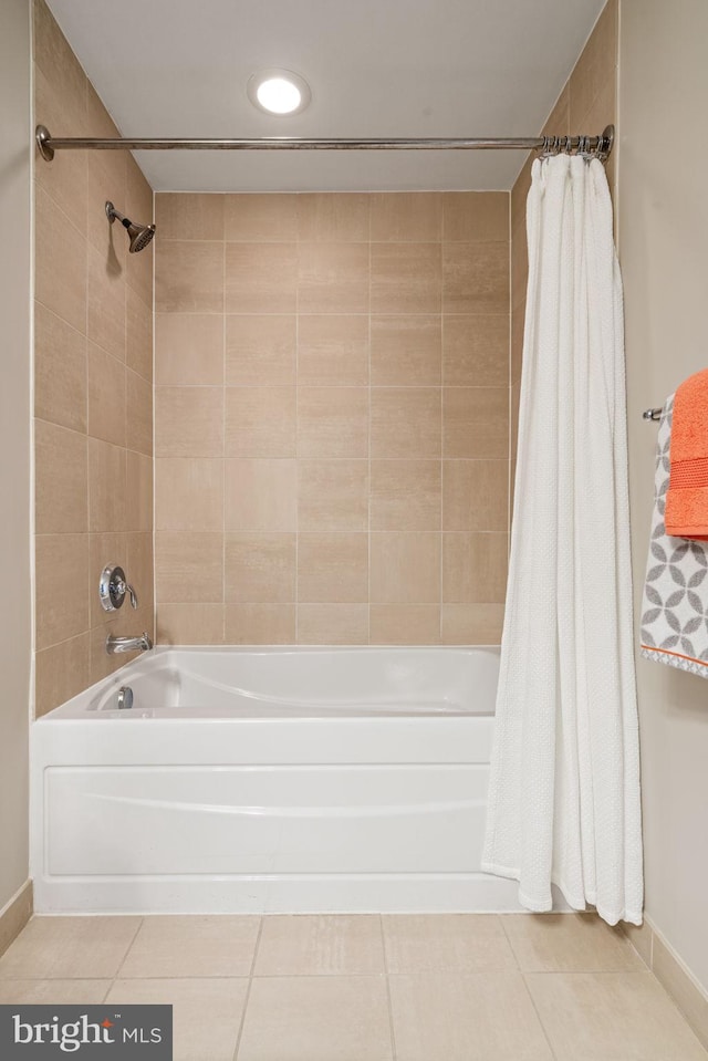 11990 Market St Unit 1311, Reston, VA 20190 - bathroom featuring baseboards, tile patterned floors, and shower / bath combo with shower curtain