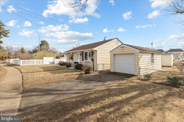 ranch-style home featuring a garage and a front lawn