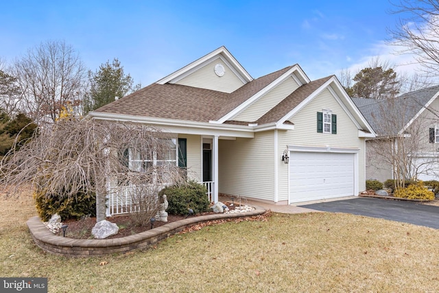 view of front of house with a garage and a front yard