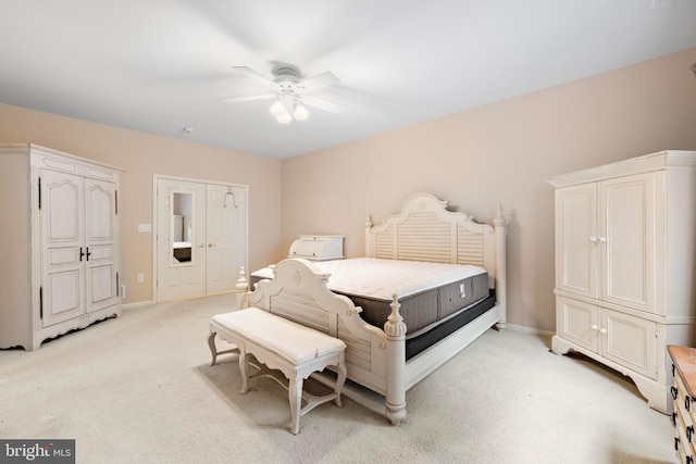 bedroom featuring ceiling fan and light colored carpet