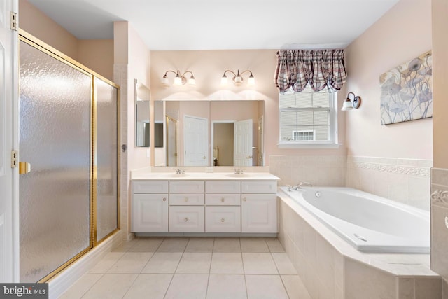 bathroom with plus walk in shower, tile patterned floors, and vanity