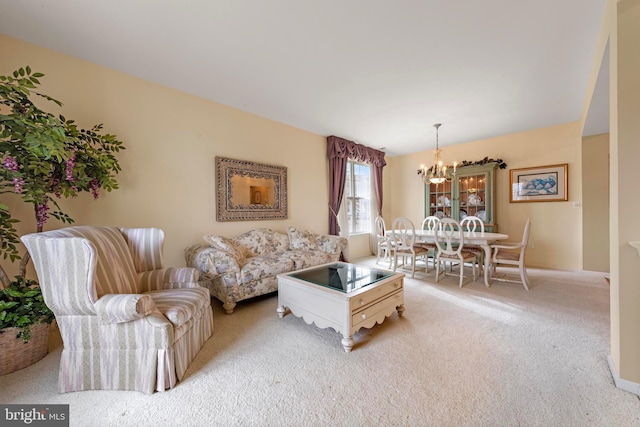 living room with light carpet and a notable chandelier