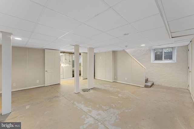 basement featuring washer / clothes dryer and a paneled ceiling