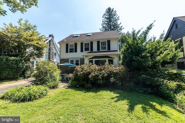 view of front of home with a front yard