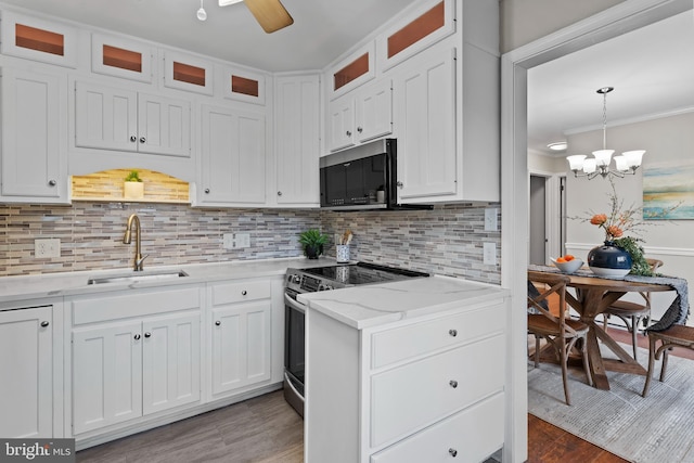 kitchen featuring appliances with stainless steel finishes, sink, and white cabinets