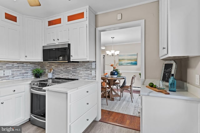 kitchen featuring stainless steel range with electric stovetop, light hardwood / wood-style floors, white cabinets, light stone countertops, and decorative backsplash