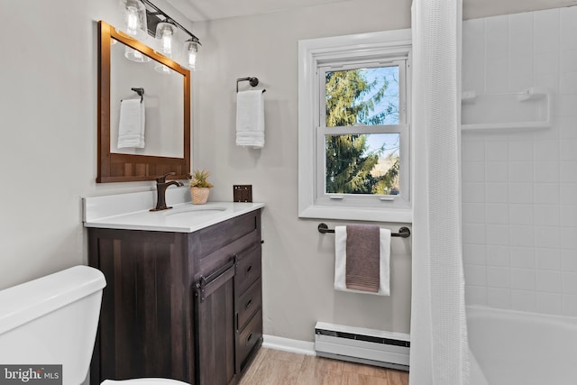 full bathroom with a baseboard heating unit, toilet, vanity, and shower / tub combo with curtain