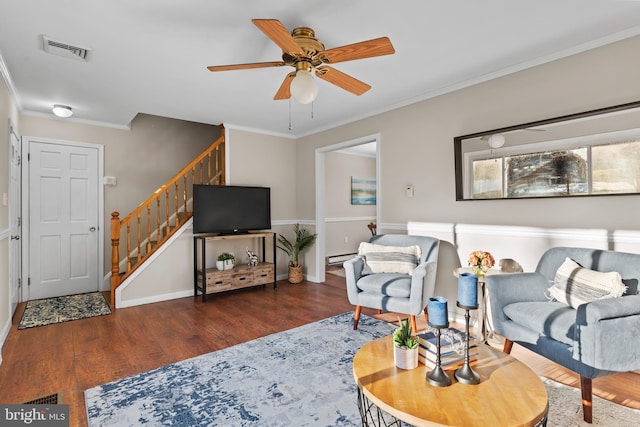 living room featuring ceiling fan, baseboard heating, dark hardwood / wood-style flooring, and ornamental molding