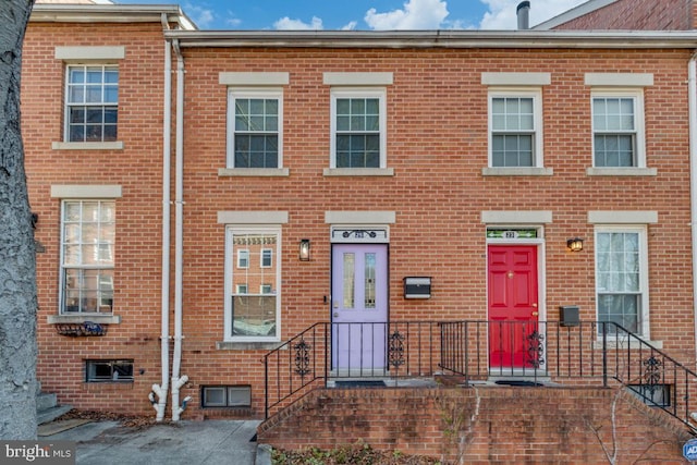 view of property featuring brick siding