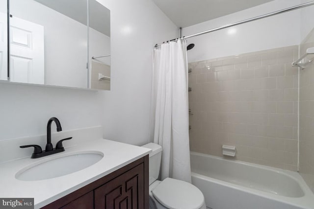 bathroom featuring toilet, shower / bathtub combination with curtain, and vanity