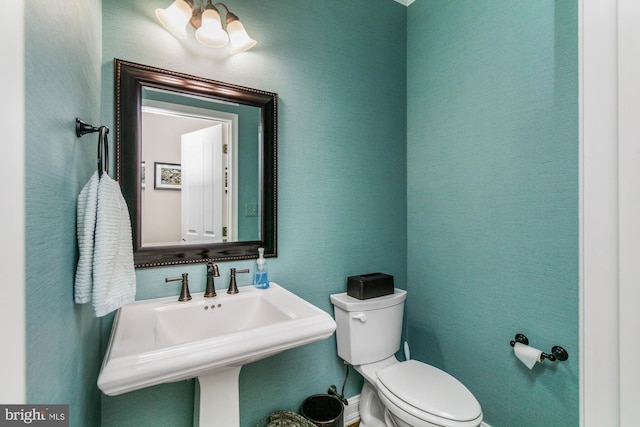 bathroom with sink and toilet